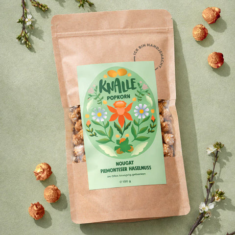 Knalle Popcorn Oster Popcorn mit Nougat und Haselnüssen, saisonale limitierte 100g Packung, frisch und knusprig.